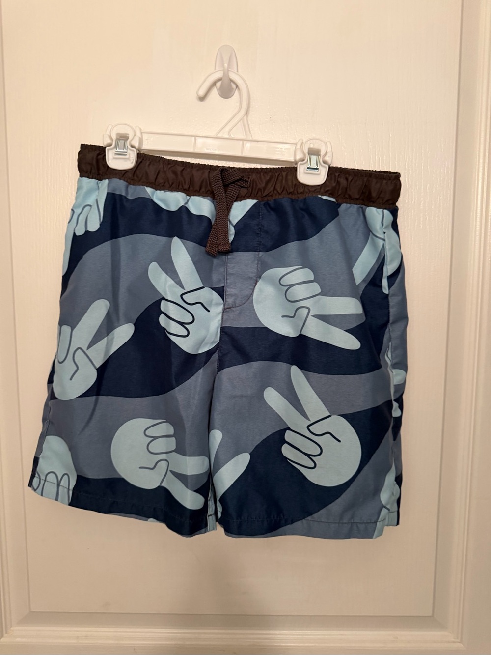Kids Blue Peace Sign Swim Trunks, coordinating rash guard included
